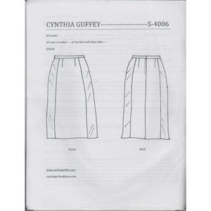 May include: A printed paper pattern for an A-line skirt with bias sides. The pattern includes front and back views of the skirt design. The text includes the designer's name, pattern number, and website.