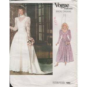 May include: Vogue Patterns Bridal Original sewing pattern. The pattern shows a bride in a white wedding dress with lace sleeves and a long train. It also features a pink dress with long sleeves. Pattern 1092.