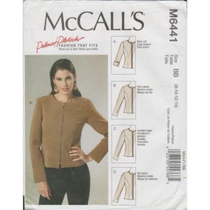 May include: McCall's sewing pattern M6441 for a jacket. The pattern includes options for wide cuffs, plain sleeves, invisible zippers, and slit sleeves. The size is BB (8-10-12-14). The jacket is shown in a brown color.