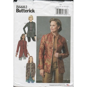 May include: Butterick sewing pattern B6602 for a jacket in sizes 14-22. The envelope features illustrations of four jacket variations, including a red floral print jacket, a black plaid jacket, a solid red jacket, and a dark patterned jacket.
