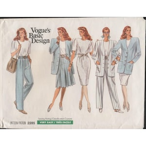 May include: Vogue's Basic Design sewing pattern featuring various women's outfits. The outfits include a skirt suit, pantsuit, and dress with jackets. The pattern is labeled "Very Easy" and includes the pattern number 2285.