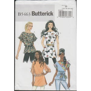 May include: A sewing pattern package labeled "B5463 Butterick" featuring illustrations of four different women's tops. The tops include floral prints, butterfly prints, and solid colors. The package also includes size information.
