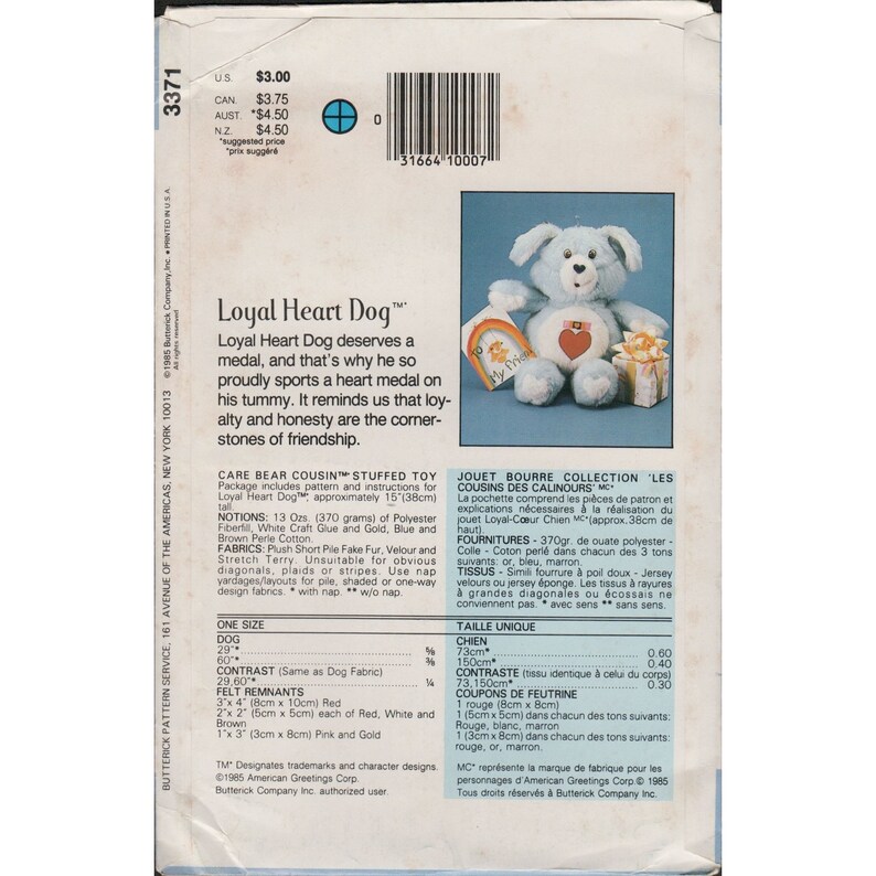 May include: A blue and white stuffed toy dog with a red heart on its chest. The dog is wearing a blue collar with a tag that says "My Friend". The dog is sitting on a white box with a red ribbon. The text "Loyal Heart Dog&trade;" is printed on the back of the package. The package also includes instructions for making the toy.