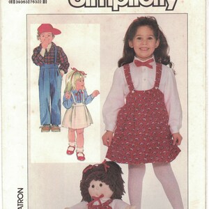 May include: Simplicity sewing pattern number 7632 for children's clothing. The pattern includes instructions for making a red and white floral print overall dress, a plaid shirt, and a blue denim overall outfit. The pattern is for sizes 6-8 and 6X-8X.