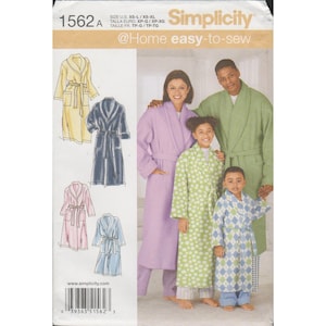 May include: Simplicity 1562A sewing pattern envelope for robes. The front shows illustrations of yellow, navy, pink, and light blue robes. A photograph displays a lavender robe, a green polka dot robe, and a blue diamond print robe.