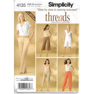 May include: Simplicity sewing pattern 4135 featuring various women's clothing designs. The pattern includes options for pants, shorts, and tops. The cover displays several models wearing the finished garments. The text "Step by step to sewing success!" is visible.