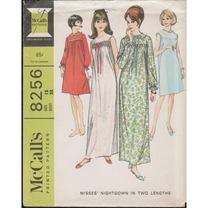 May include: Vintage McCall's sewing pattern for a women's nightgown in two lengths. The pattern is number 8256, size 12, bust 32. The pattern shows three different styles of nightgowns: one red, one white with floral print, and one blue.