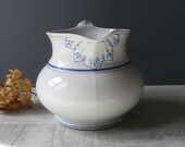 Antique White Ironstone Pitcher with Blue and Gold Leave decor.