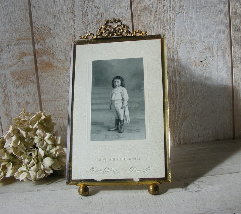 Antique Glass and Brass Photo Frame.Portrait of child.End of the 19th century.