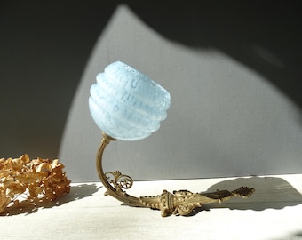 Vintage Bronze Sconce with blue Clichy glass shade.