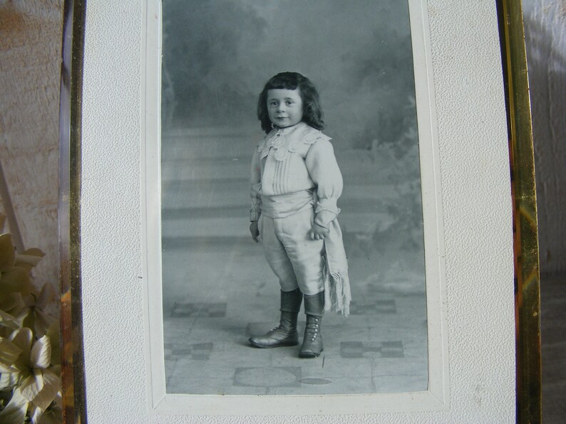 Antique Glass and Brass Photo Frame.Portrait of child.End of the 19th century.