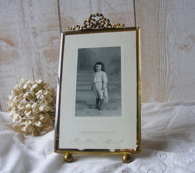 Antique Glass and Brass Photo Frame.Portrait of child.End of the 19th century.