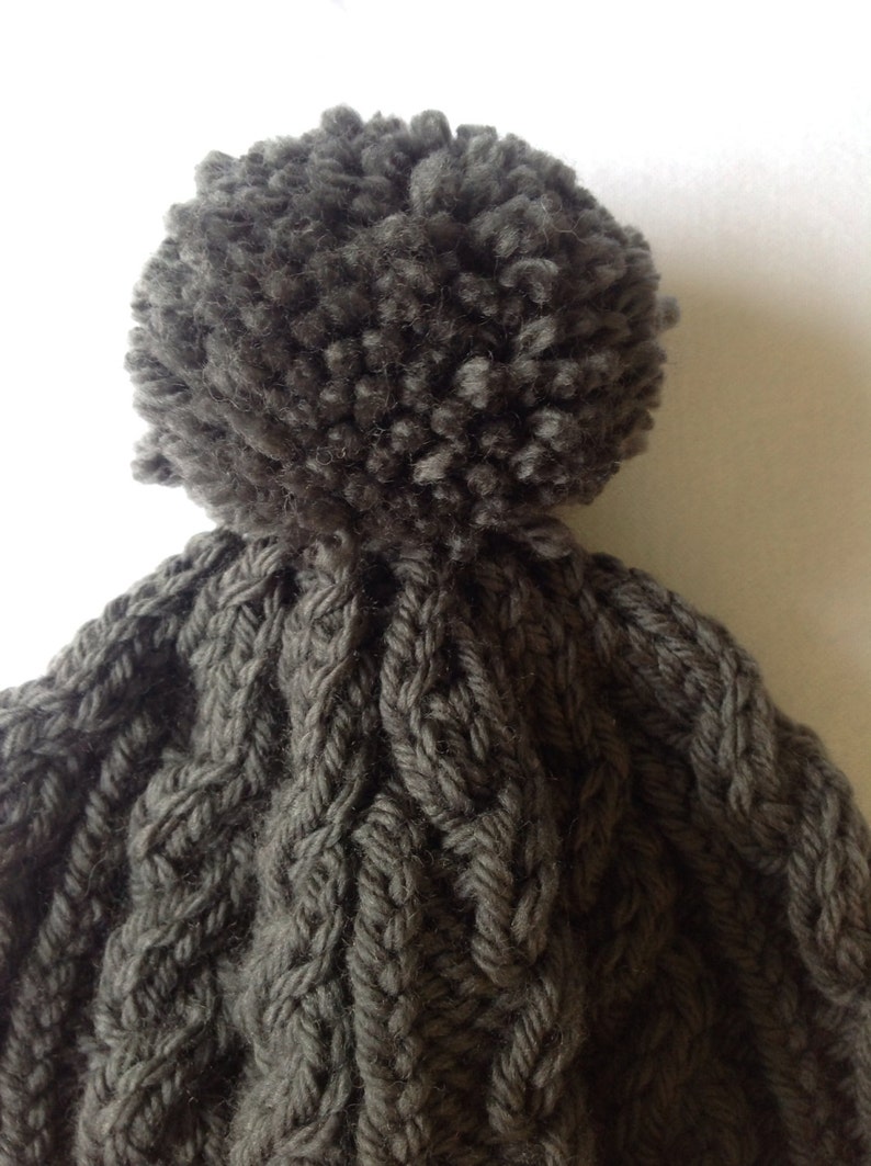 range of sizes available from 0-3 to 24 months on trend for autumn 2014 Charcoal grey hand knitted aran beanie bobble hat