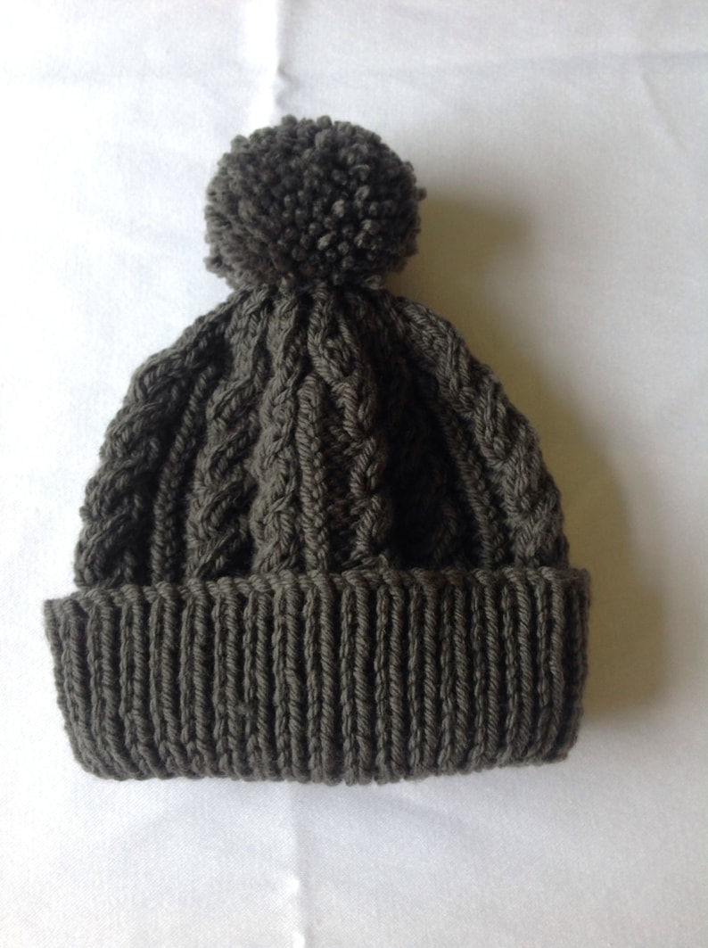 range of sizes available from 0-3 to 24 months on trend for autumn 2014 Charcoal grey hand knitted aran beanie bobble hat