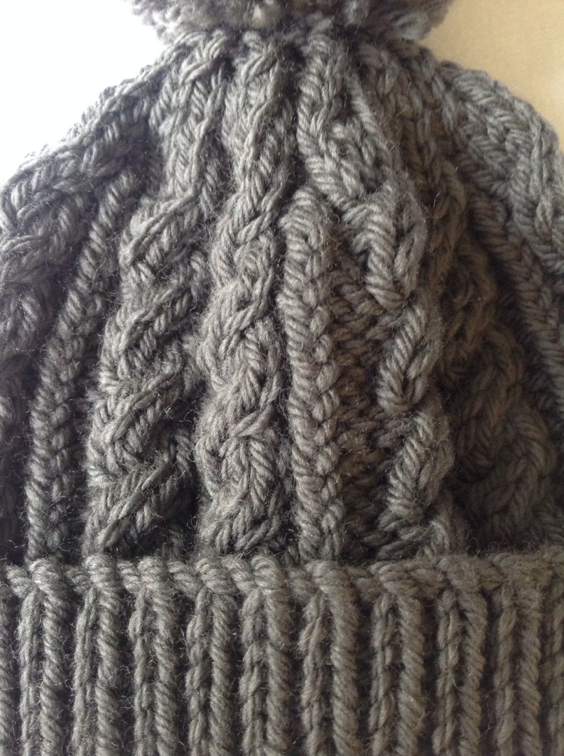range of sizes available from 0-3 to 24 months on trend for autumn 2014 Charcoal grey hand knitted aran beanie bobble hat