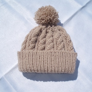 Hand knitted aran beanie bobble hat, fawn colour - range of sizes available from 2 years to teenage (Unisex)