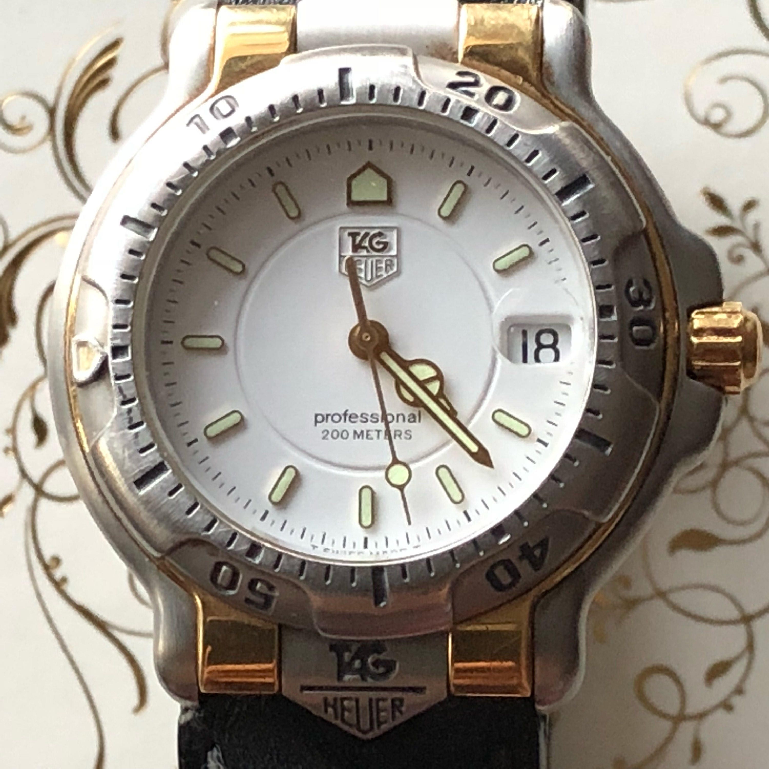 Vintage Tag Heuer 6000 Series Unisex Mid Size Stainless And 18kt Gold vintage-tag-heuer-6000-series-unisex-mid-size-stainless-and-18kt-gold