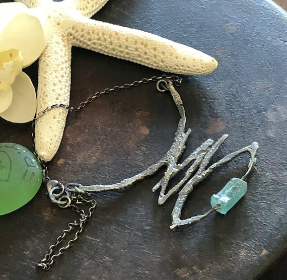 Raw sterling and ancient roman sea glass