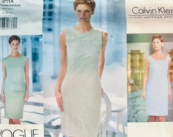 May include: Vogue Patterns sewing pattern featuring Calvin Klein designs. The pattern includes options for sleeveless dresses. The front of the pattern shows a woman in a light blue dress. The pattern number is 2114, and the size range is 8-10-12.