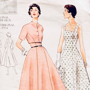 May include: Vintage Vogue sewing pattern featuring two 1954 dress designs. One dress is a peach-colored, button-down style with a belt. The other is a white dress with a green floral pattern. The pattern includes the text "ORIGINAL 1954 DESIGN".