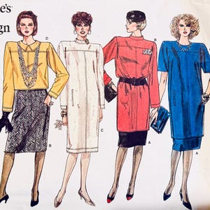 May include: A fashion illustration from Vogue's Basic Design, showcasing five women in different outfits. The outfits include a purple dress, a yellow top with a patterned skirt, a white coat dress, a red coat dress, and a blue dress. Each outfit is accessorized with jewellery and shoes.
