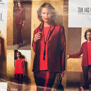 May include: Vogue pattern V2826 showing a red suit with a jacket, top, and trousers. The pattern includes sizes 8, 10, and 12. The design is by Tom and Linda Platt, American designers.