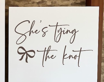 She’s Tying the Knot Vinyl | Bridal Shower Backdrop Display with Bow for Engagement Party Decor, Bride-to-Be Celebration Sign (Decal Only)