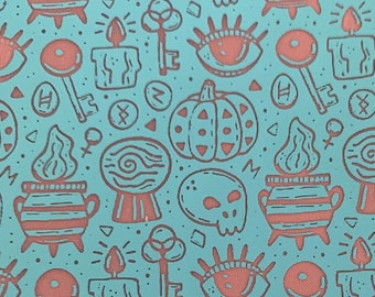 May include: A teal blue background with a repeating pattern of various Halloween-themed illustrations in a coral pink colour. The illustrations include a cauldron, a pumpkin, a skull, a key, a candle, an eye, and a spiral.