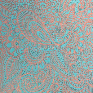 May include: A close-up of a teal background with a copper-colored paisley pattern. The design features intricate floral and swirling elements, creating a detailed and ornate visual texture. The pattern is evenly distributed across the surface.