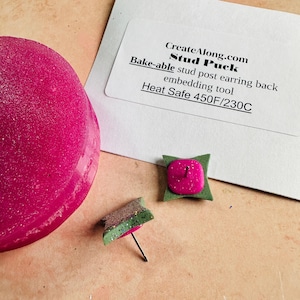 May include: A pink and green stud post earring back embedding tool. The tool is heat safe up to 450 degrees Fahrenheit or 230 degrees Celsius. CreateAlong.com Stud Puck.