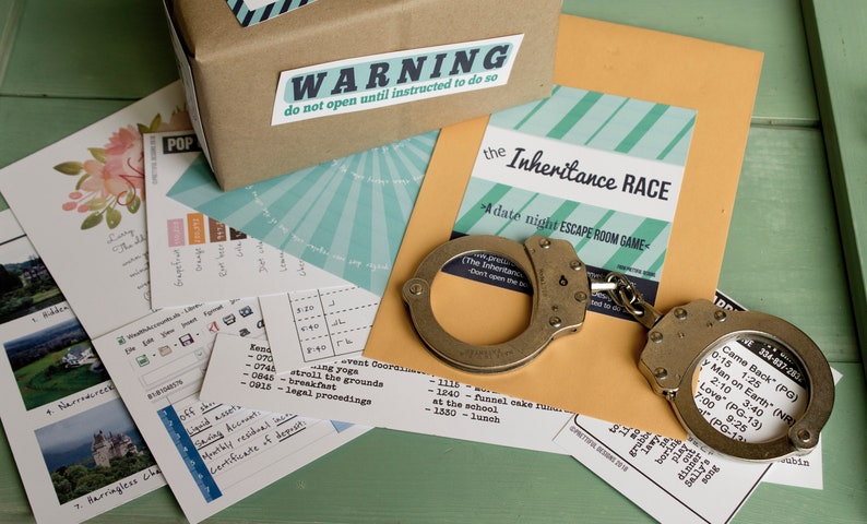 May include: A brown cardboard box with a warning label that says "do not open until instructed to do so". The box is surrounded by various papers, including a card with the text "the Inheritance RACE - A date night ESCAPE ROOM GAME" and a pair of silver handcuffs.