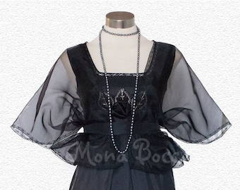 May include: A black formal gown with a sheer overlay and a beaded bodice. The gown has a fitted bodice and a flowing skirt.