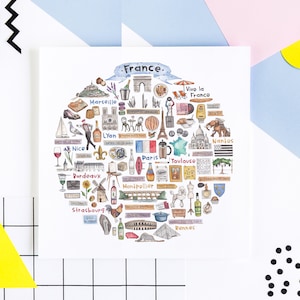 Puede incluir: Una ilustración de acuarela de Francia con un círculo de monumentos emblemáticos, ciudades y símbolos. La ilustración incluye la Torre Eiffel, el Arco del Triunfo, la Catedral de Notre Dame, el Louvre y mucho más. El texto "France" y "Vivo la France" está incluido en la ilustración.