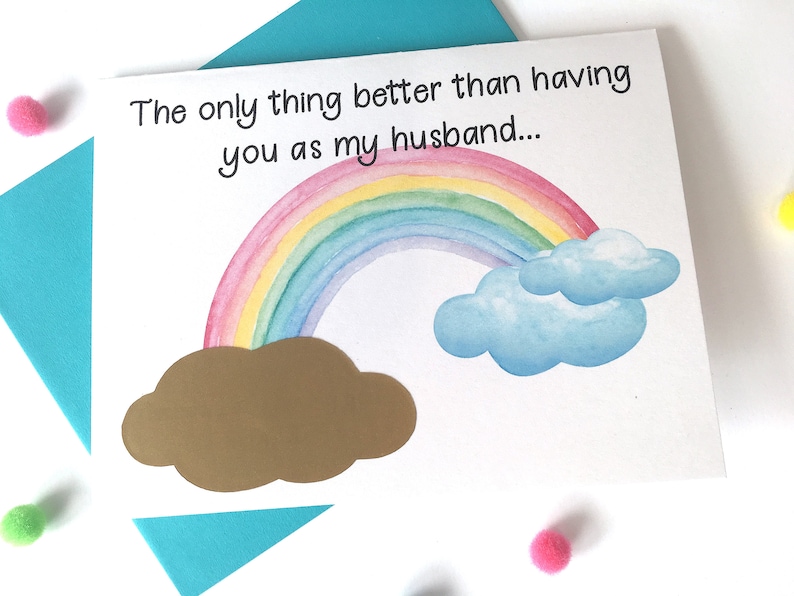 May include: A card with a rainbow and clouds, and the text "The only thing better than having you as my husband..."