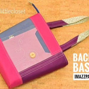 May include: A pink, purple, and blue tote bag with a patterned fabric handle. The bag has a small pocket on the front and the text "BACK TO BASICS" and "IMAZZPATTERNS" is printed on the bottom right corner.
