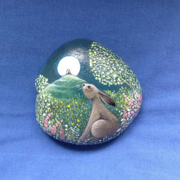 Tor gazing Hare. Hand painted beach pebble by Jan Fowler.