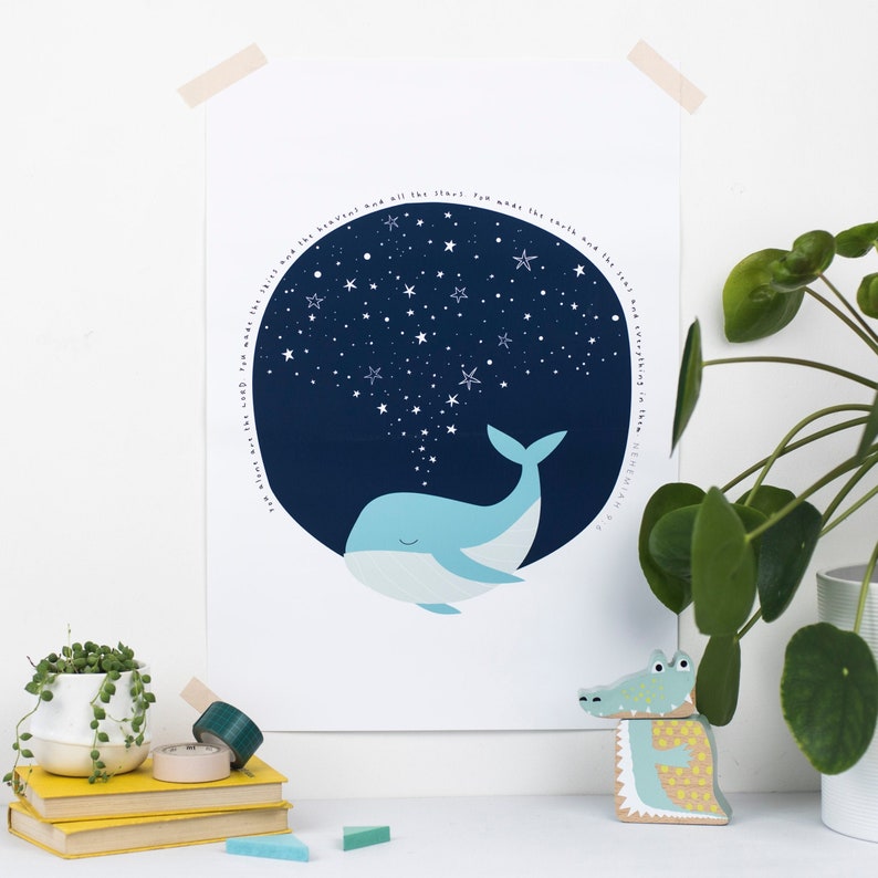 May include: A light blue whale illustration with a dark blue starry sky background. The print includes the text "Where are the clouds you made the earth and the sea, and everything in them. NEHEMIAH 9:6". The artwork is displayed on a white background.