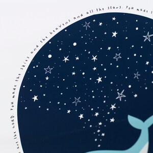 May include: A navy blue and white art print featuring a whale and a starry night sky. The text "You made the skies and the heavens and all the stars" is written around the edge of the dark blue circle. The whale is light blue.