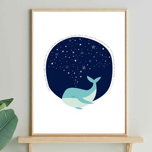 May include: A framed art print featuring a whimsical illustration of a blue whale with a starry night sky emanating from its blowhole. The whale is set against a white background, with a wooden frame. The artwork has a minimalist style.
