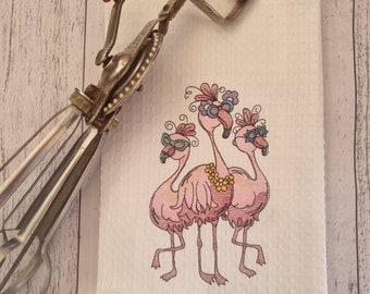 Three flamingos tea towel