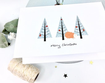 Hedgehog Christmas Card . Christmas Tree and Hedgehog . Picking out the Christmas tree in the woods. Whimsical Chrisstmas Card