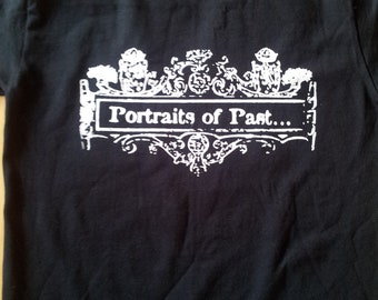 May include: Black t-shirt with a white graphic design of a decorative frame with the text "Portraits of Past..." in the centre.