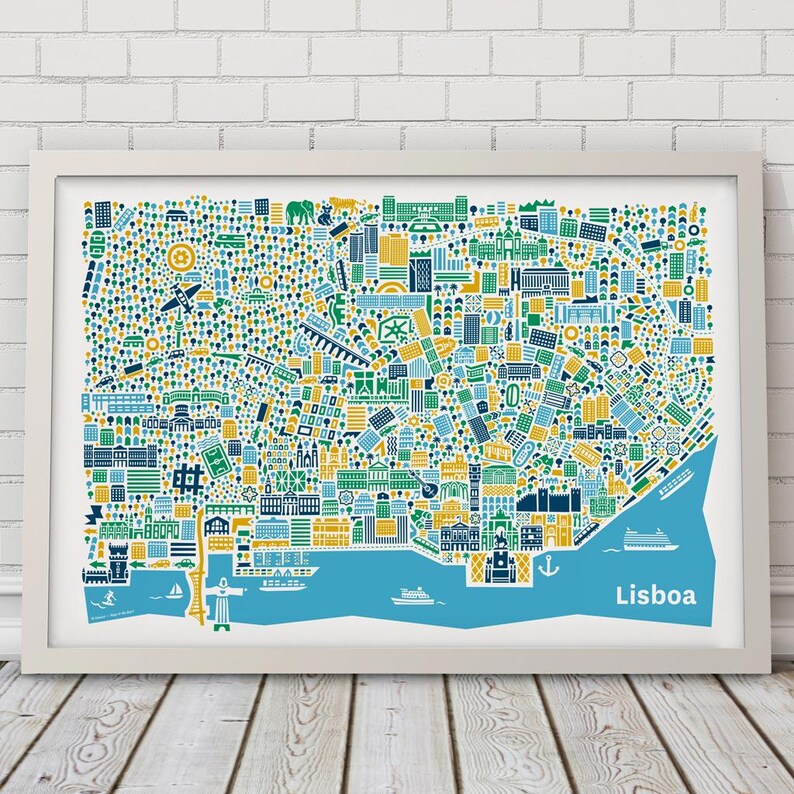May include: A framed art print of Lisbon, Portugal, featuring a colorful, stylized map. The map uses blue, green, yellow, and white to depict buildings, landmarks, and the Tagus River. The word "Lisboa" is written in blue at the bottom right.