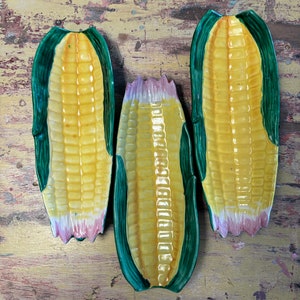 Set of three Majolica corn ear dishes, Vintage. Pink, yellow and green. Ear corn.