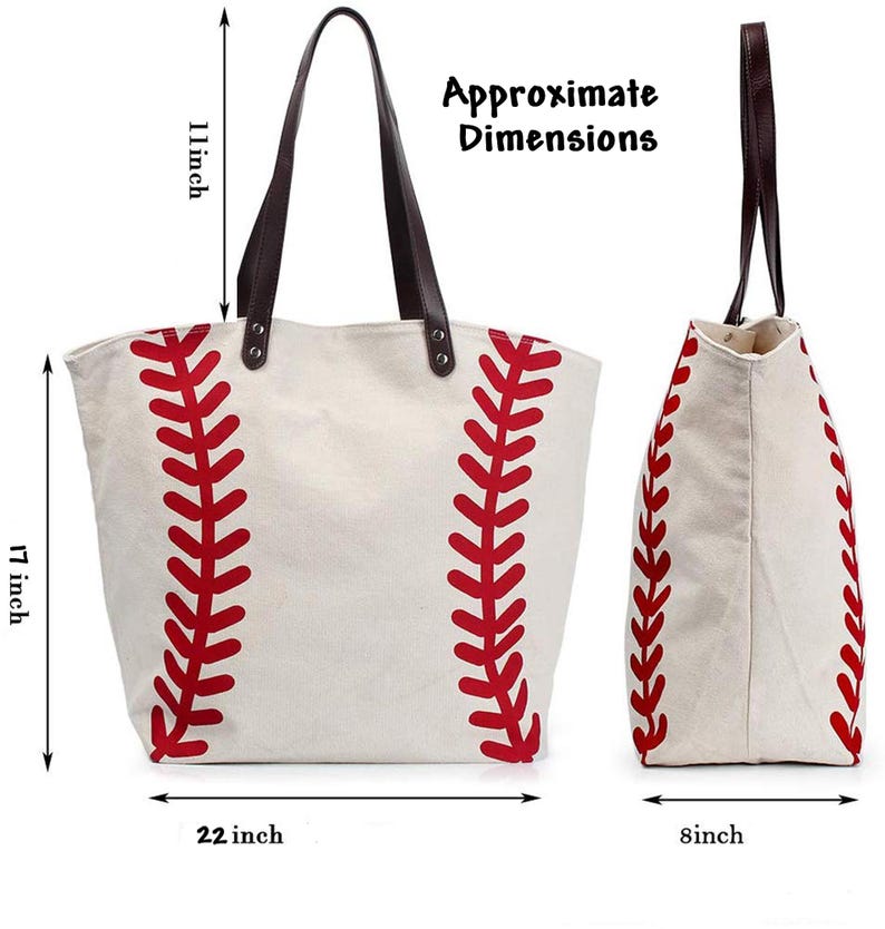 May include: A cream-colored canvas tote bag with a red baseball stitch pattern, dark brown leather straps, and metal rivets. The bag measures 17 inches in height, 22 inches in width, and 8 inches in depth, with an 11-inch strap drop height.