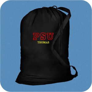 Black drawstring cotton or canvas laundry bag with red and yellow embroidery in Varsity Initials design. The embroidery reads 'PSU' on top with 'THOMAS' below.