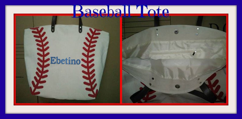 A large off white canvas tote bag with printed red baseball stitching and the monogram name 'Ebetino' in blue thread. The bag is shown open to reveal the white lining, inner zippered pocket and black faux leather straps.