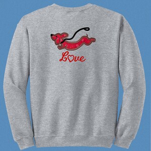 May include: Gray sweatshirt with a red dachshund running with a leash and the word "Love" with a red heart in the center.