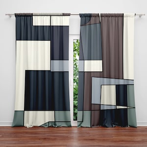 May include: A pair of curtains with a geometric pattern in shades of gray, blue, and white. The curtains are made of a soft, textured fabric and have a modern, abstract design.