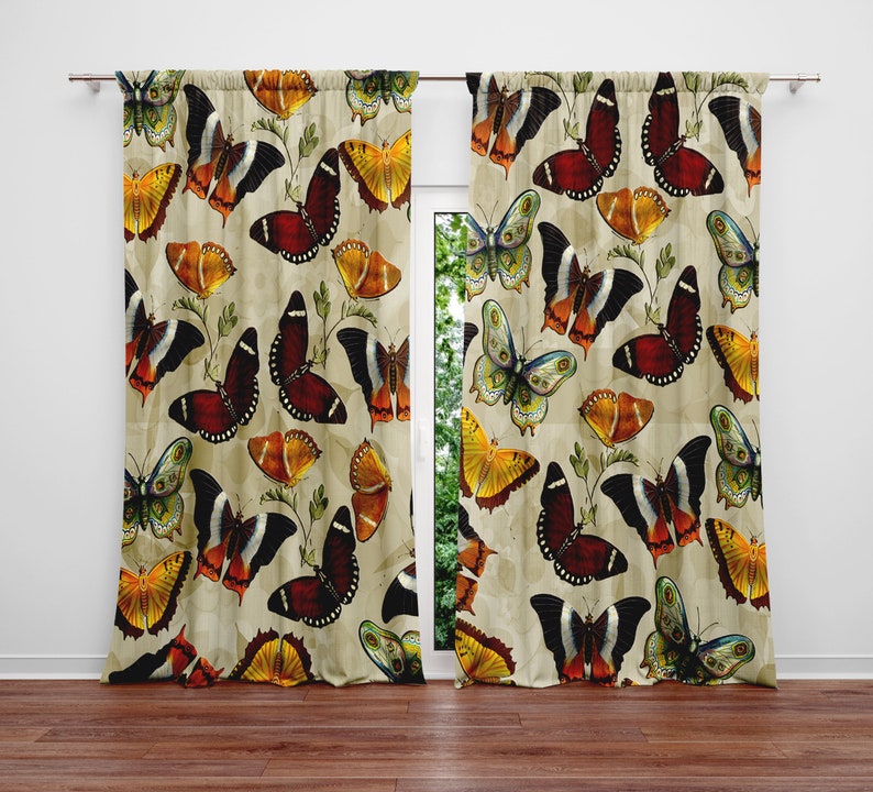 May include: A pair of beige curtains with a repeating pattern of colorful butterflies. The butterflies are in various shades of orange, red, yellow, green, and blue.